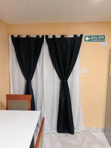 a black and white curtain in a room at Apartamento Patagonia in Puerto San Julián