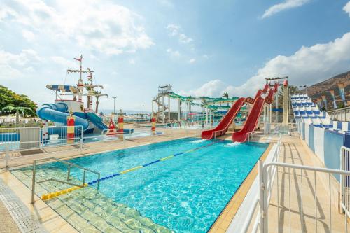 a pool on a cruise ship with a slide at Gai Beach Hotel in Tiberias