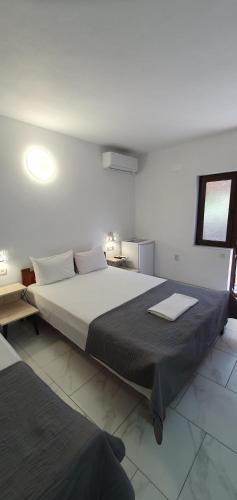 a bedroom with a large bed in a room at Casa Ghemus Costinesti in Costinesti