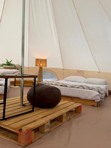 two beds on a wooden platform in a tent at Villa Verde in Perquín