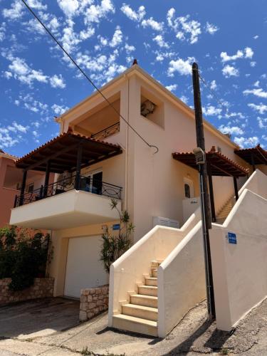 a house with stairs in front of it at Kanelli΄s apartments in Monemvasia