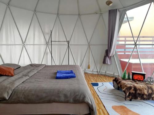 a bedroom with a large bed in a tent at วิวดีภูทับเบิก in Ban Maeo Thap Boek