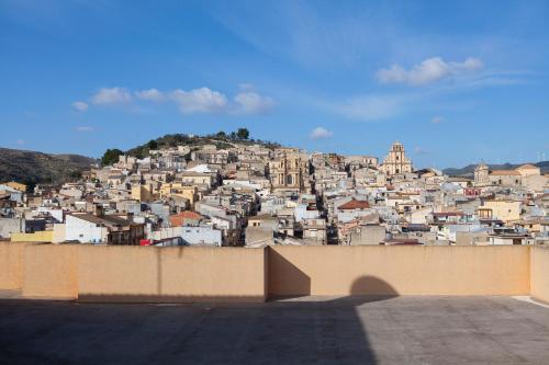 a view of a city from above a wall at Suite "La Perla degli Iblei" in Giarratana