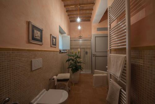 a bathroom with a sink and a toilet in it at Le Logge Ritrovate in Acquasparta