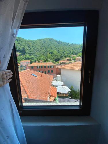 a window in a room with a view of a city at Casa Tre Fiori 3 in Mignanego