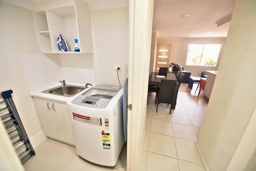 a kitchen and dining room with a sink and a dishwasher at Midland Haven - Midland WA in Midland Junction
