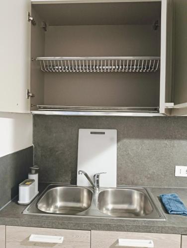 a stainless steel sink in a kitchen at Aaron guest house 1 in Marghera