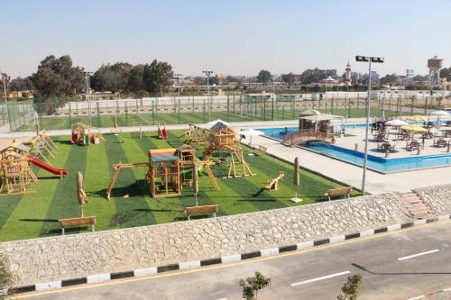an amusement park with a playground and a slide at The Guard Hotel in Cairo