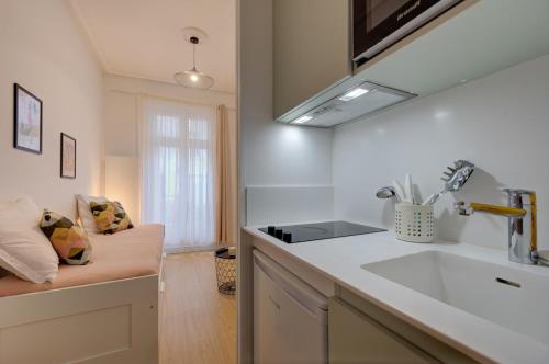 a kitchen with a sink and a counter top at Viktor 1 - Studio Hyper Centre - Place Jean Jaurès in Tours