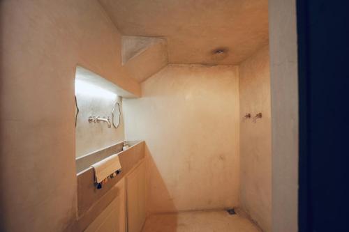 a bathroom with a sink and a shower at Riad Sahara - Private House Rooftop Medina Marrakech in Marrakesh