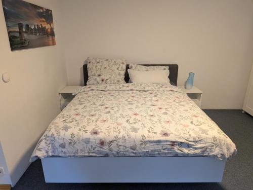 a bedroom with a bed with a blue light on it at Ferienwohnung Tammer Allee in Tamm