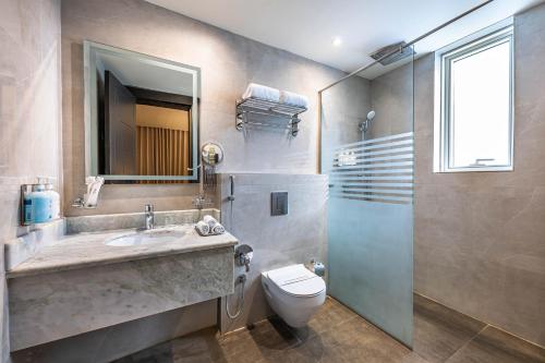 a bathroom with a sink and a toilet and a shower at Sama Inn Hotel in Riyadh
