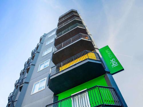 a tall building with balconies on the side of it at Ibis Styles Brindisi in Brindisi