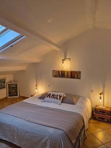 a bedroom with a large bed in a room at LA GRANGE TEMPLIERE 2018 in Peyreleau