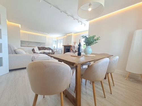 a living room with a dining room table and chairs at Rosales Collection Vacation Villa in Medina de Pomar