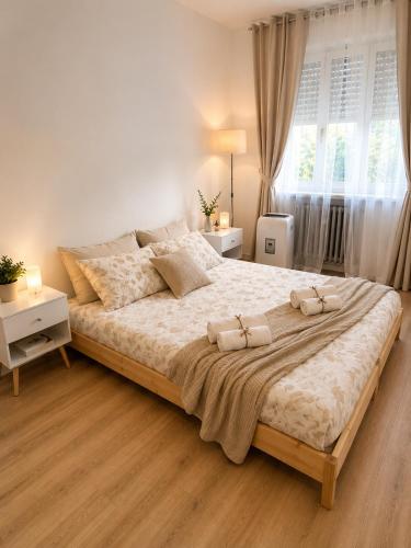 a bedroom with a large bed with two pillows on it at Near Airport Malpensa Pvt Room with Pvt Bath and Kitchen Check-in 24h in Legnano