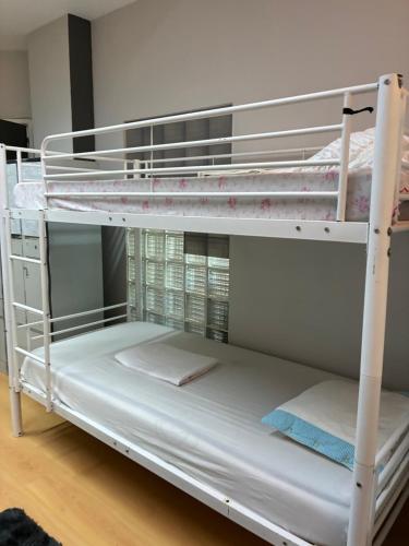 a couple of bunk beds in a room at Hostel da Maria - Porto in Vila Nova de Gaia