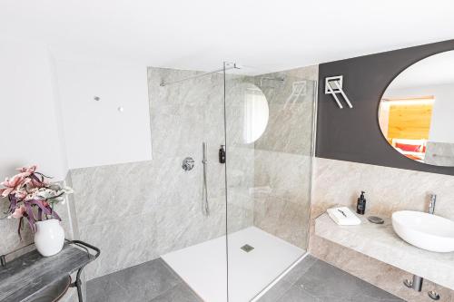 a bathroom with a shower and a sink at Adamello skyline in Temù