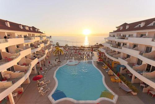an aerial view of a hotel with a swimming pool at Sholeo Lodges Los Gigantes in Puerto de Santiago