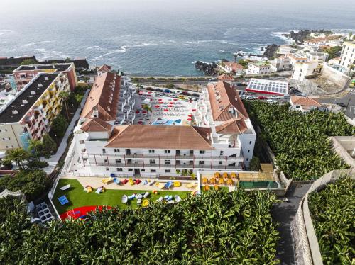 an aerial view of the hotel and the ocean at Sholeo Lodges Los Gigantes in Puerto de Santiago