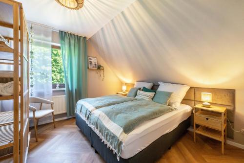 a bedroom with a bed and a window at Anker in Papendorf