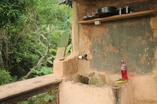 a bottle is sitting on the side of a wall at Canto de Paz Trindade Hospedagem in Trindade