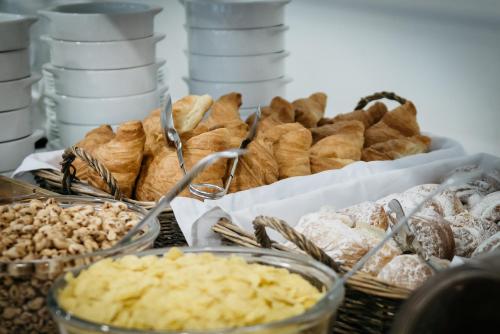 a table topped with lots of different types of pastries at Hotel Teremar in Benidorm