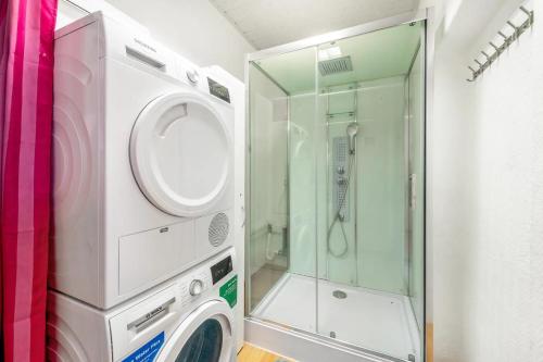 a washing machine and a shower in a bathroom at Pension in Malchin in Malchin