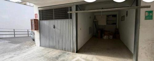 a garage with a door open in a building at Salentini house in Lecce
