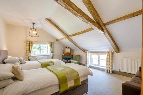 a bedroom with three beds in a room at 6 Bed in Norwich oc-42594 in Shelton