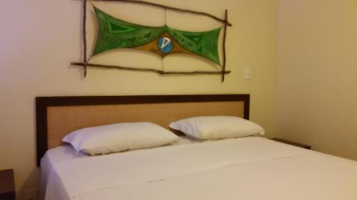 Una cama o camas en una habitación de Solar Pipa Apartments