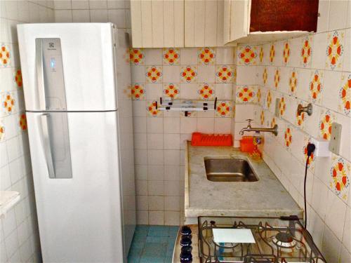 A cozinha ou cozinha compacta de Guarujá Apartment