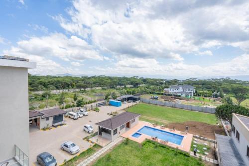 an aerial view of a house with a yard and a pool at Sebai Laxury Suit in Nairobi