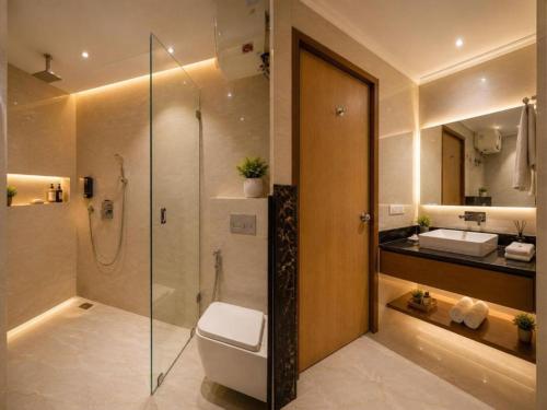 a bathroom with a shower and a toilet and a sink at The Runway Corporate Hotel IGI Delhi Airport Terminal-3 With Free Airport Pickup in New Delhi