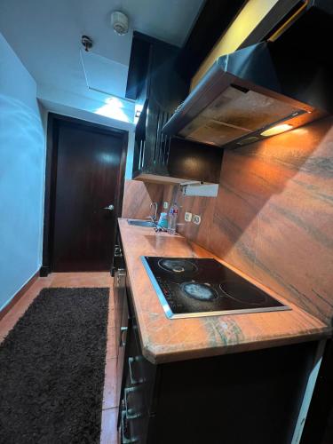 a kitchen with a counter with a sink in it at 2BR Sea View Chalet Porto sokhna in Ain Sokhna