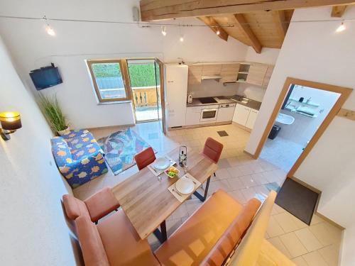 a kitchen and dining room with a table and chairs at Apartment Vöstl by Interhome in Navis