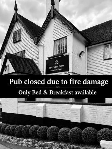 a building with a pub closed due to fire damage at The Dorset Arms Pub & Cottage Rooms in Groombridge