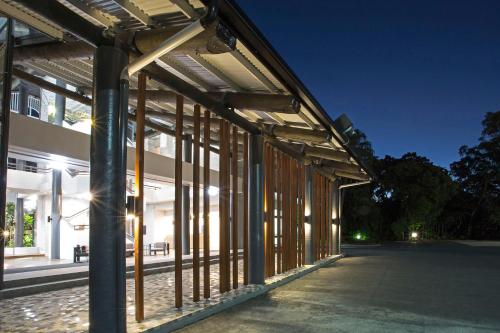 an external view of a building at night at Mantra Club Croc in Airlie Beach