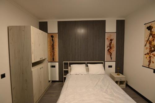 a bedroom with a large white bed in it at Jivani 105 in Gyumri