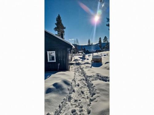 a snow covered yard with footprints in the snow at Chalet Vrådal by Interhome in Vradal