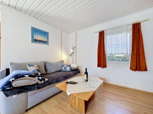 a living room with a couch and a table at Apartment Gabi-1 by Interhome in Wiek auf Rügen