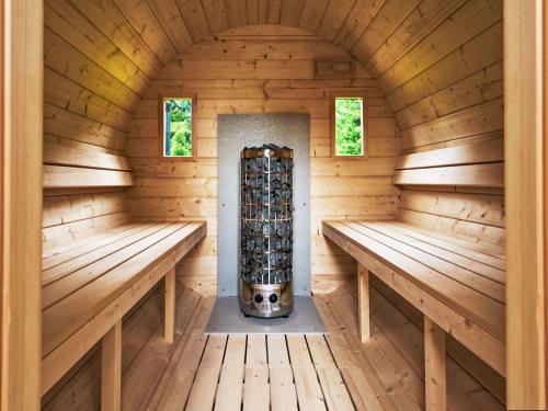 an inside view of a sauna with two benches at Chalet Golden View by Interhome in Janske Lazne