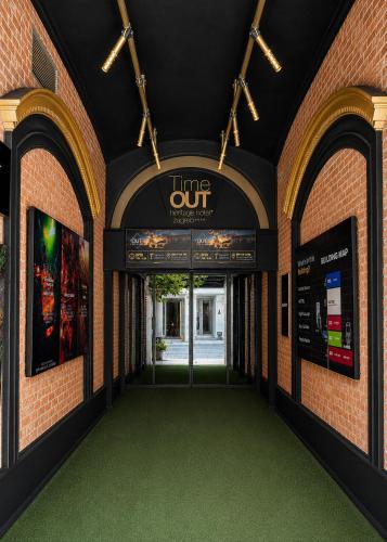 an entrance to a building with a time out sign at Timeout Heritage Hotel Zagreb in Zagreb