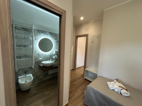 a bathroom with a sink and a mirror at B&B La Casa Nel Borgo in Morano Calabro