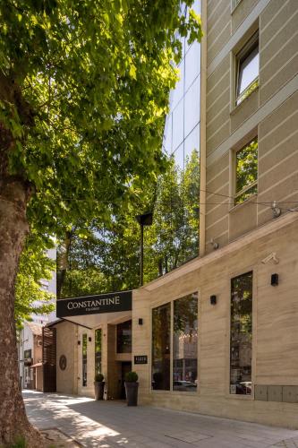 a building with a sign on the front of it at Hotel Constantine the Great in Belgrade