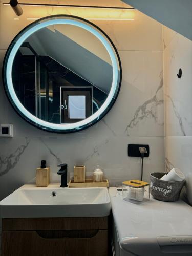 a bathroom with a sink and a mirror at Bonaca Residence in Makarska