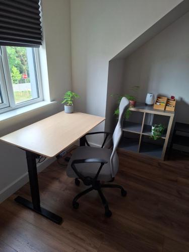 an office with a desk and a chair and a table at Spacious ensuite bedroom in Kiltiernan