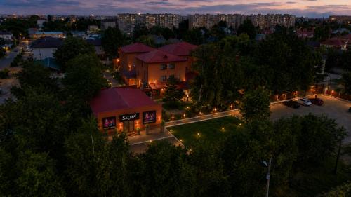 an overhead view of a building at night with lights at Marko Polo Hotel in Aksay