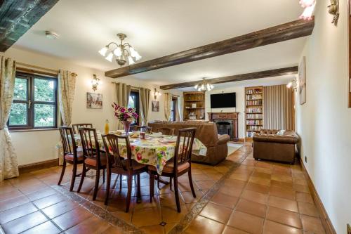 a kitchen and living room with a table and chairs at 3 Bed in Acle oc-b41410 in Acle
