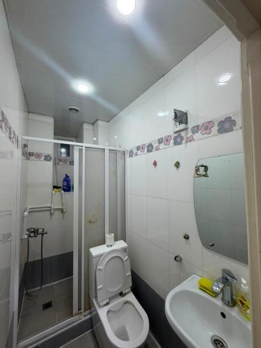a bathroom with a toilet and a sink and a shower at best hotel yerevan in Yerevan